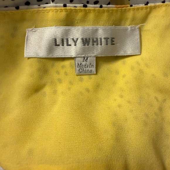 Lily White v neck top with black design with yellow flowers. Hi-Lo Size Medium - Picture 6 of 8